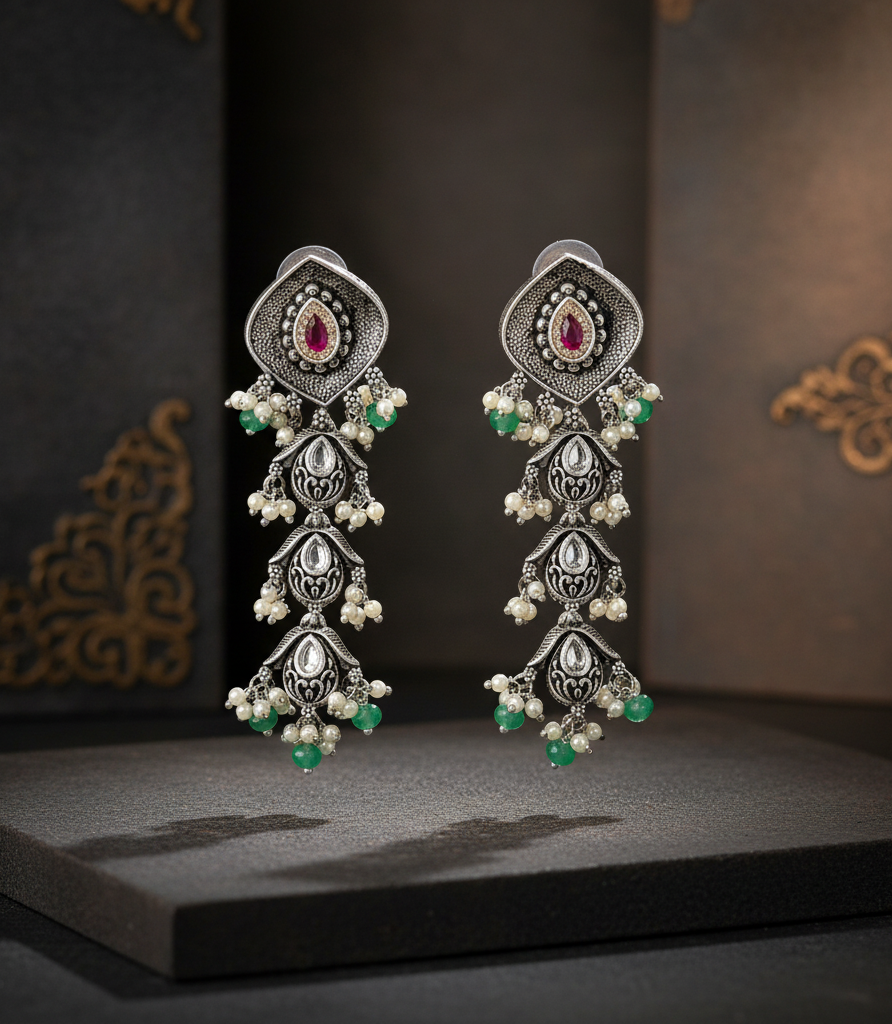 Aurevia Fashion Jewellery Jhansi Aadhya oxidized silver drop earrings with ruby stones, white pearls, and green beads.