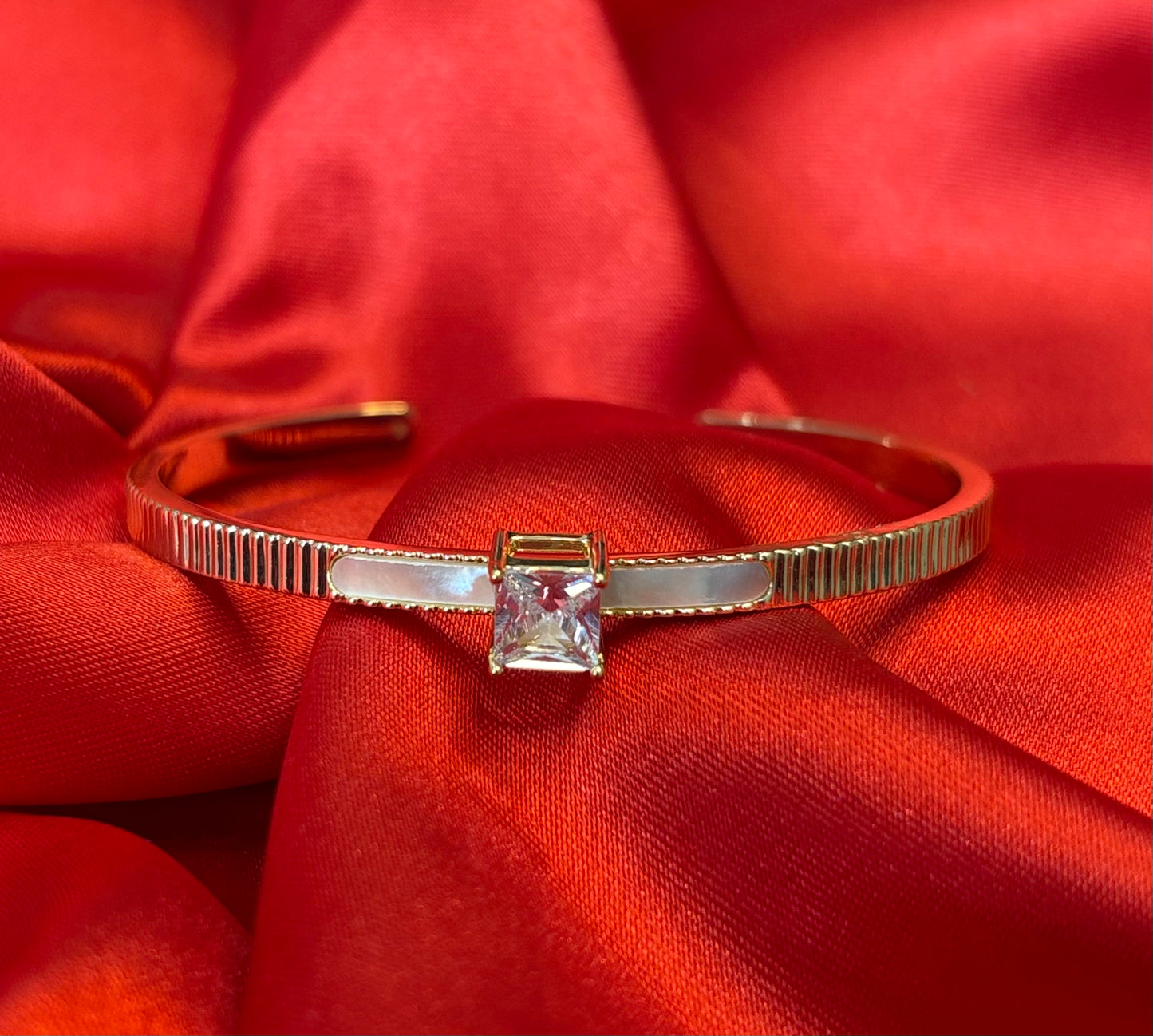 Gold-tone Princess Cut Center Stone Cuff Bangle