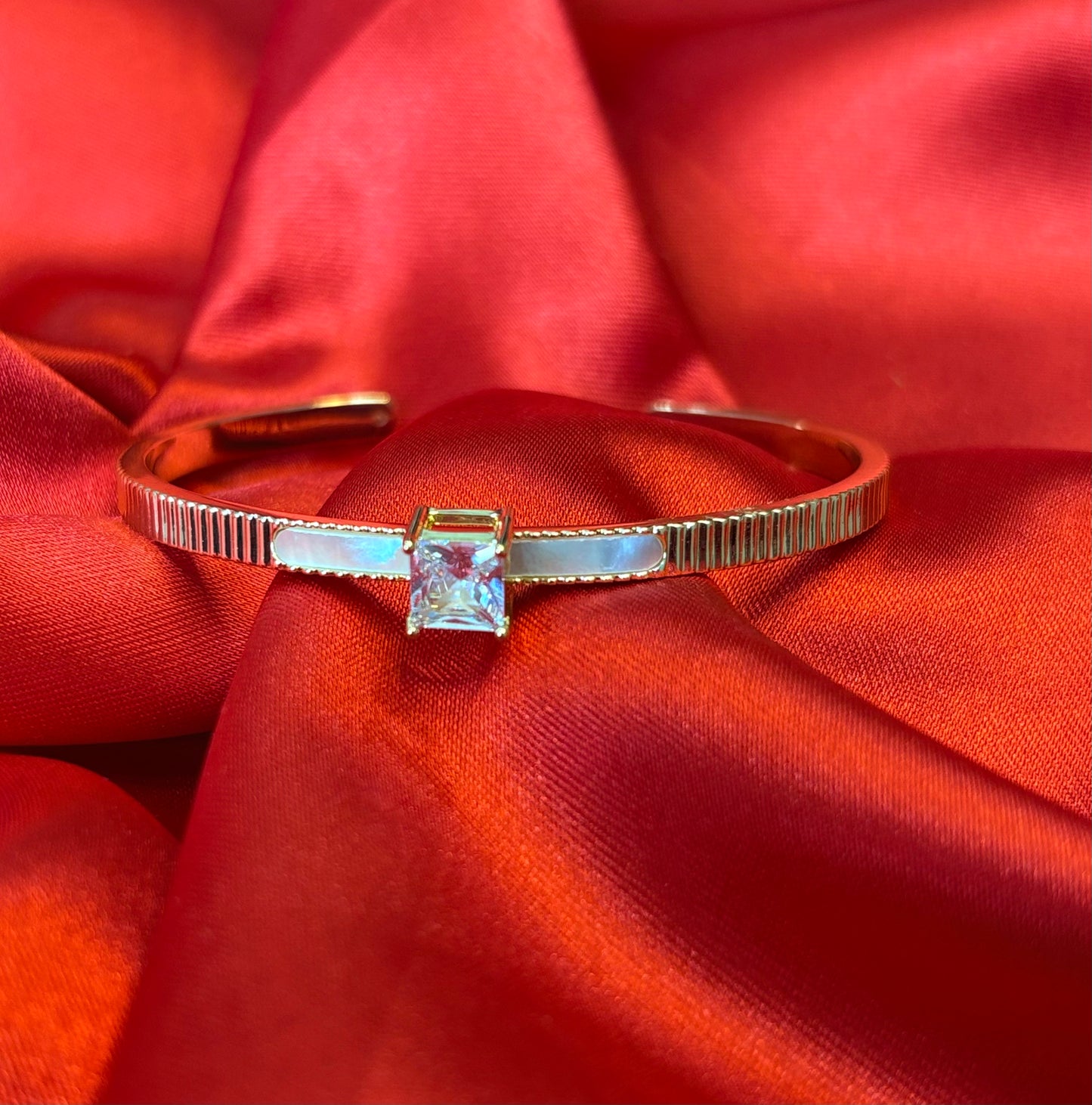 Gold-tone Princess Cut Center Stone Cuff Bangle