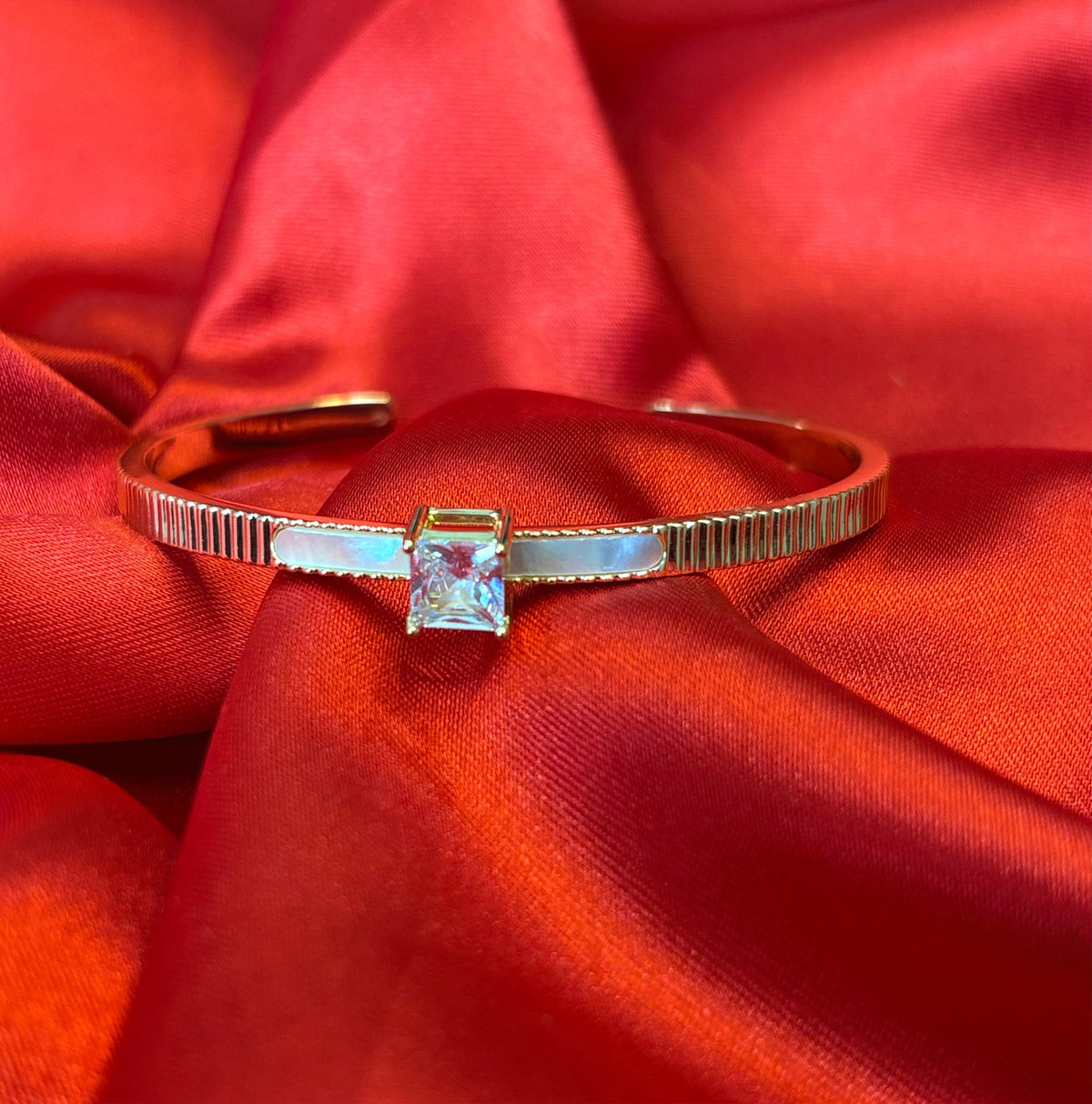 Gold-tone Princess Cut Center Stone Cuff Bangle