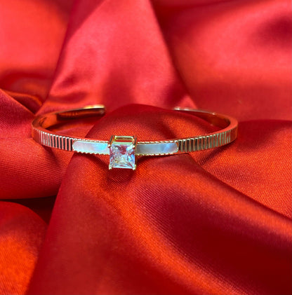Gold-tone Princess Cut Center Stone Cuff Bangle