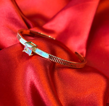 Gold-tone Princess Cut Center Stone Cuff Bangle