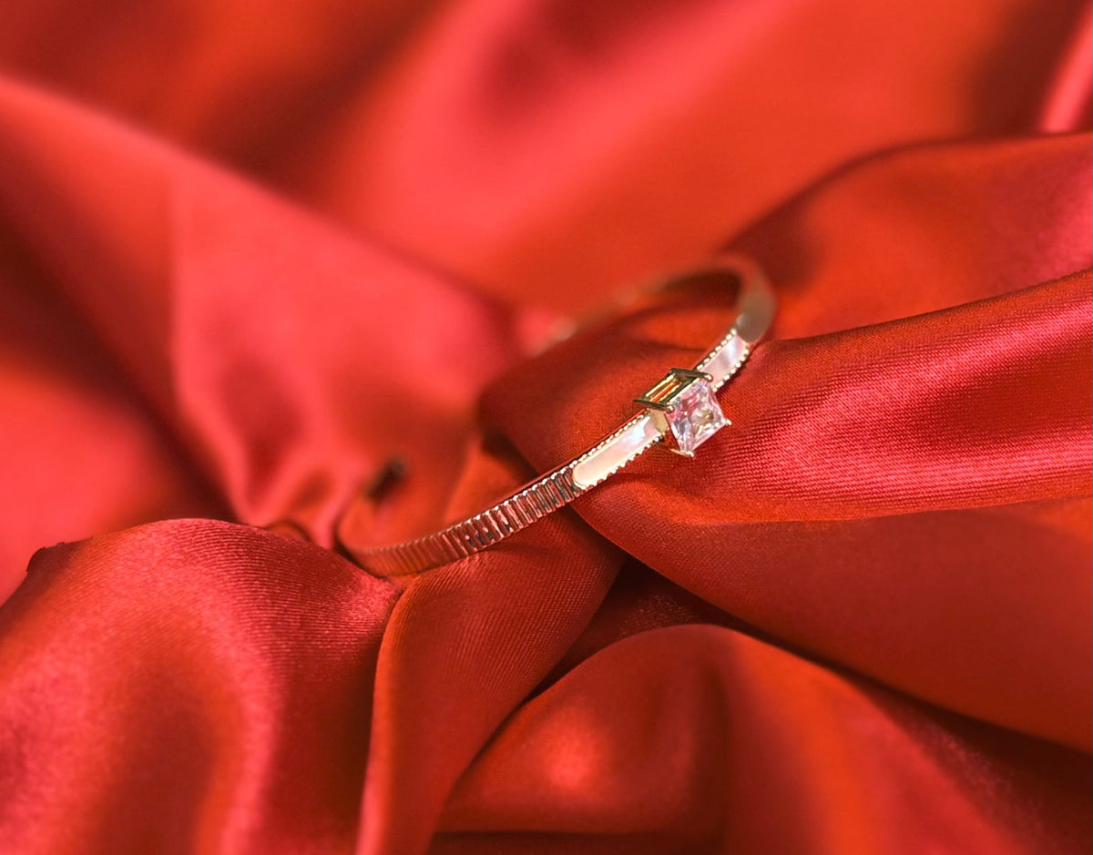 Gold-tone Princess Cut Center Stone Cuff Bangle