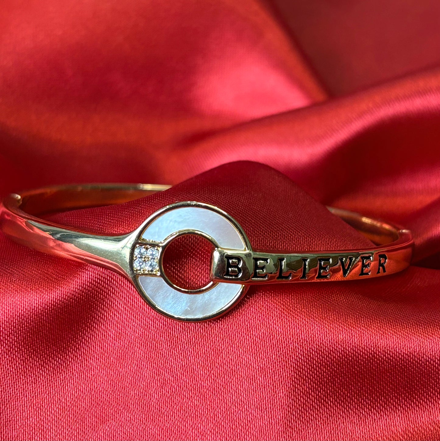 Gold Tone Circular Charm With BELIEVER Bangle