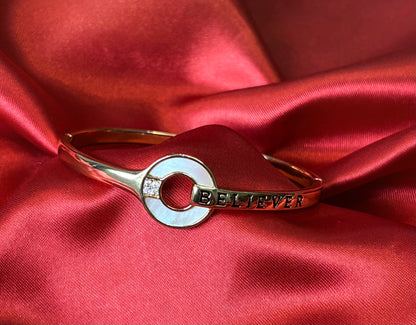 Gold Tone Circular Charm With BELIEVER Bangle