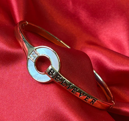 Gold Tone Circular Charm With BELIEVER Bangle