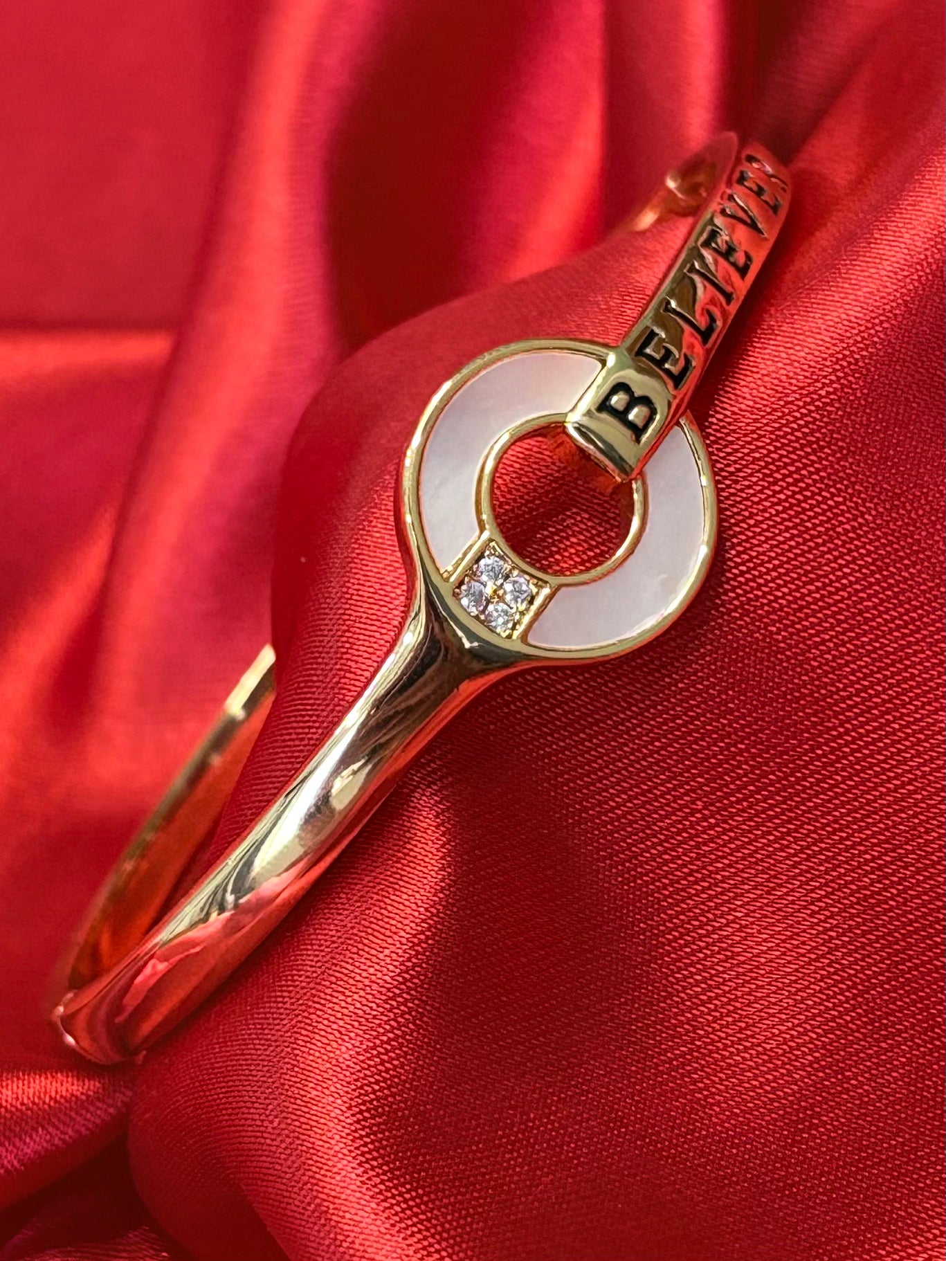 Gold Tone Circular Charm With BELIEVER Bangle