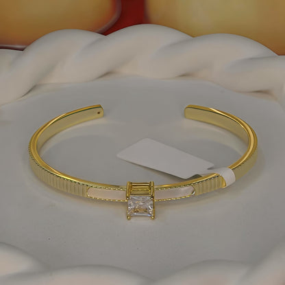 Gold-tone Princess Cut Center Stone Cuff Bangle