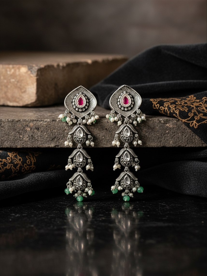 Aurevia Fashion Jewellery Jhansi Aadhya oxidized silver drop earrings with pink stones, white pearls, and green beads.