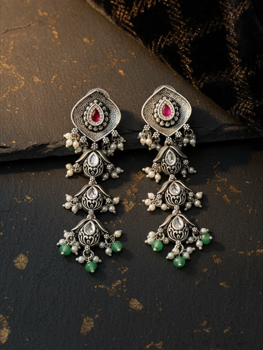 Aurevia Fashion Jewellery Jhansi Aadhya oxidized silver drop earrings with pink stones, white pearls, and green beads.