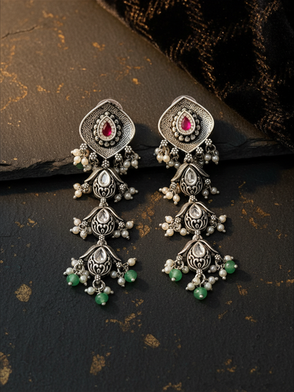 Aurevia Fashion Jewellery Jhansi Aadhya oxidized silver drop earrings with pink stones, white pearls, and green beads.