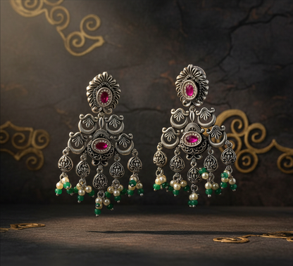 Aurevia Fashion Jewellery Jhansi Heritage silver chandelier earrings with pink stones, pearls, and green beads.