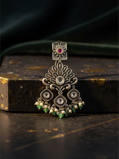Aurevia Fashion Jewellery Jhansi Regal oxidized silver earring with pink stone, green beads, and pearl accents.