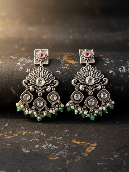 Aurevia Fashion Jewellery Jhansi Regal silver-toned statement earrings with intricate filigree, pearls, and green beads