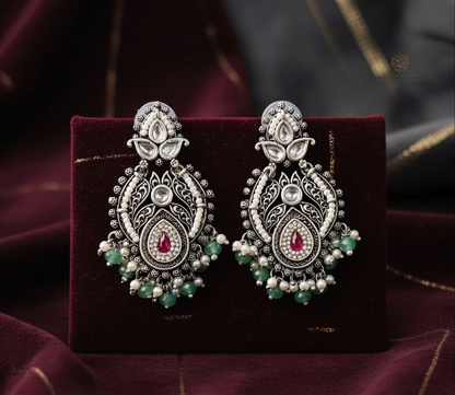 Aurevia Fashion Jewellery Jhansi Royale silver plated earrings with red stones, white pearls, and green beads.