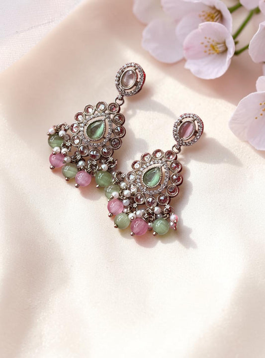 Aurevia Fashion Jewellery multi-color kundan drop earrings with pastel gemstones and intricate metalwork on silk