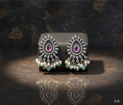 Aurevia Fashion Jewellery Jhansi Majesty oxidized silver earrings with teardrop pink stones, pearls, and green beads.