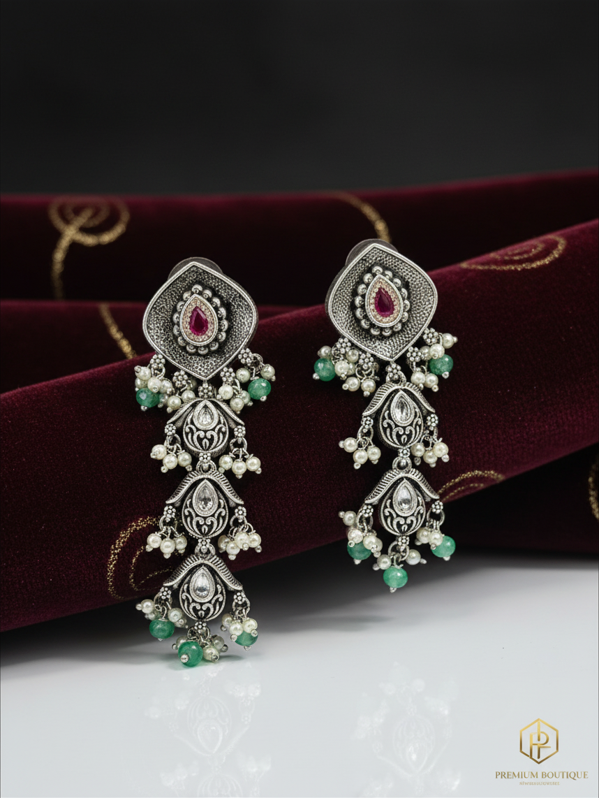 Aurevia Fashion Jewellery Jhansi Aadhya oxidized silver drop earrings with pink stones, white pearls, and green beads.