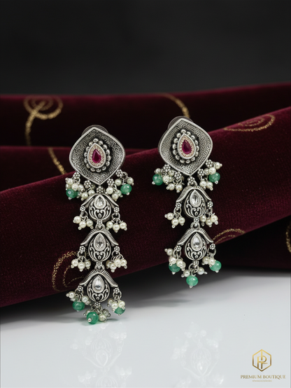 Aurevia Fashion Jewellery Jhansi Aadhya oxidized silver drop earrings with pink stones, white pearls, and green beads.