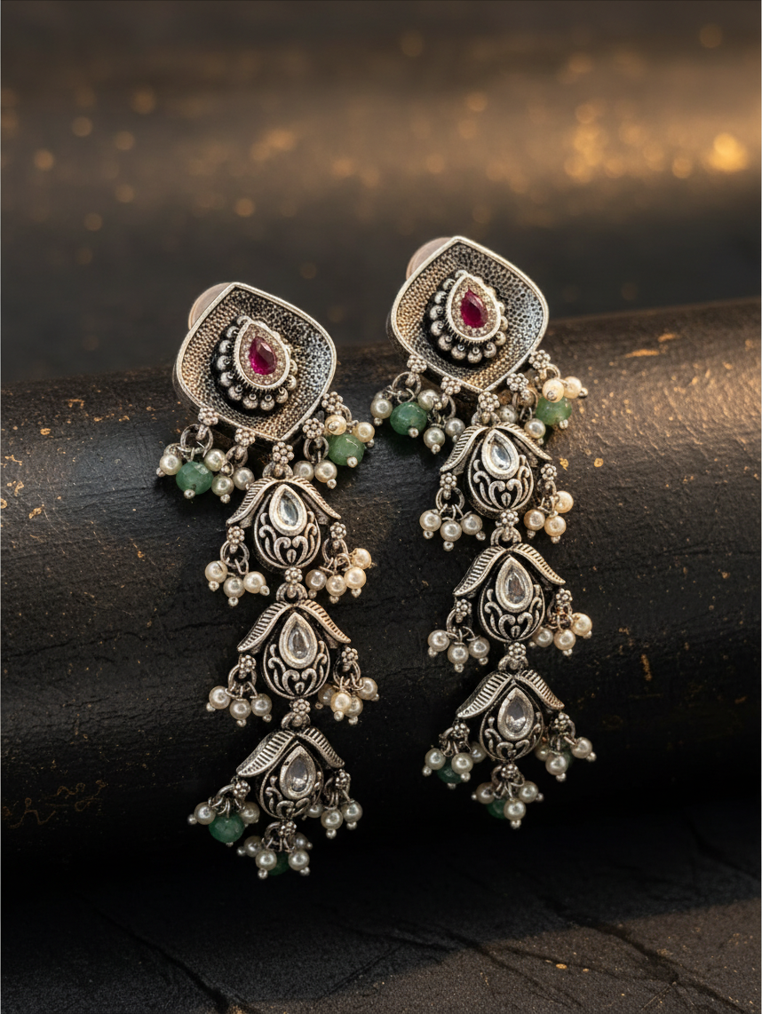 Aurevia Fashion Jewellery Jhansi Aadhya oxidized silver drop earrings with ruby, green beads, and pearl accents.