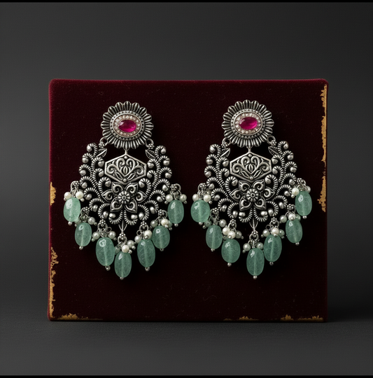 Aurevia Fashion Jewellery Jhansi Grace oxidized silver chandelier earrings with pink stones and green bead drops.